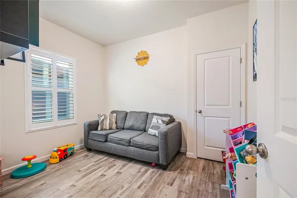 a living room with furniture and toys
