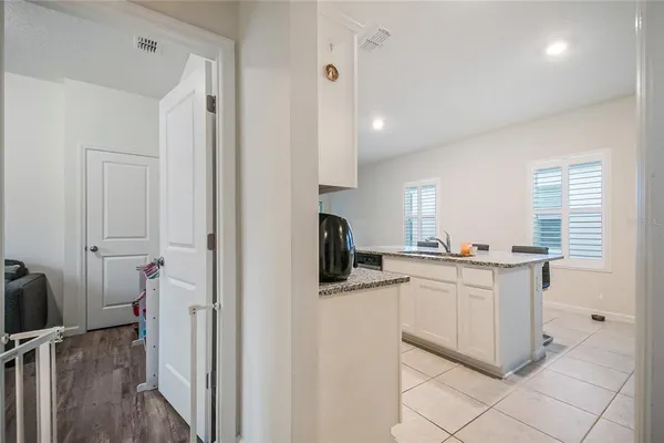 a kitchen with a sink and cabinets