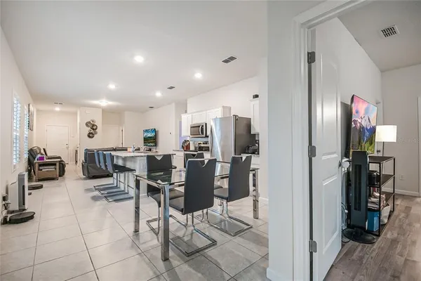 a view of a living room and dining room