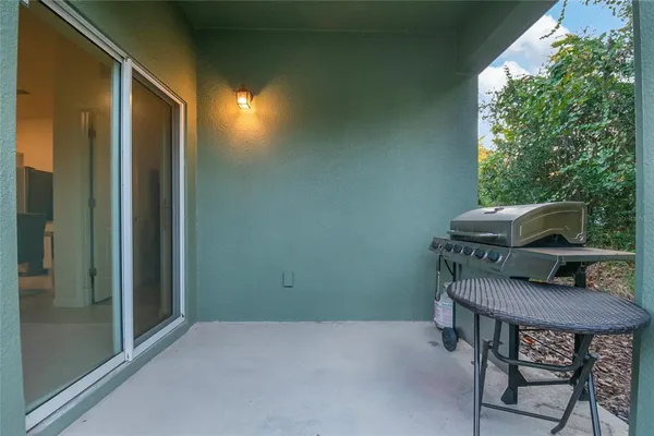a balcony with table and chairs