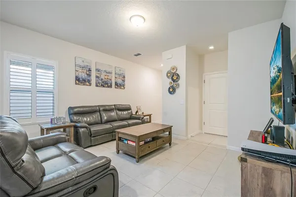 a living room with furniture and a window