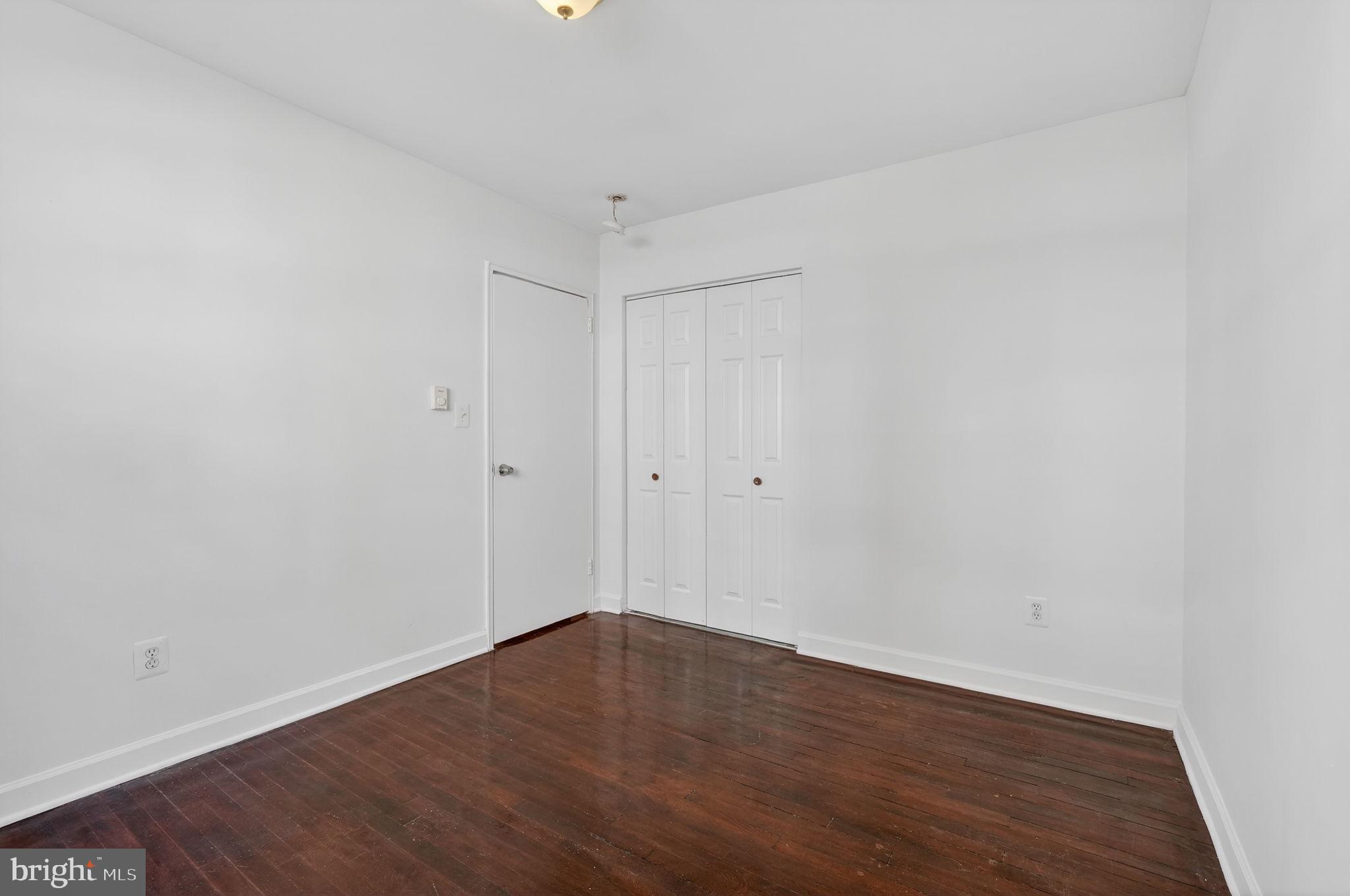 2523 13th Street Northwest, Unit 305 Washington, DC 20009 - Photo 18 of 29 a view of an empty room with wooden floor