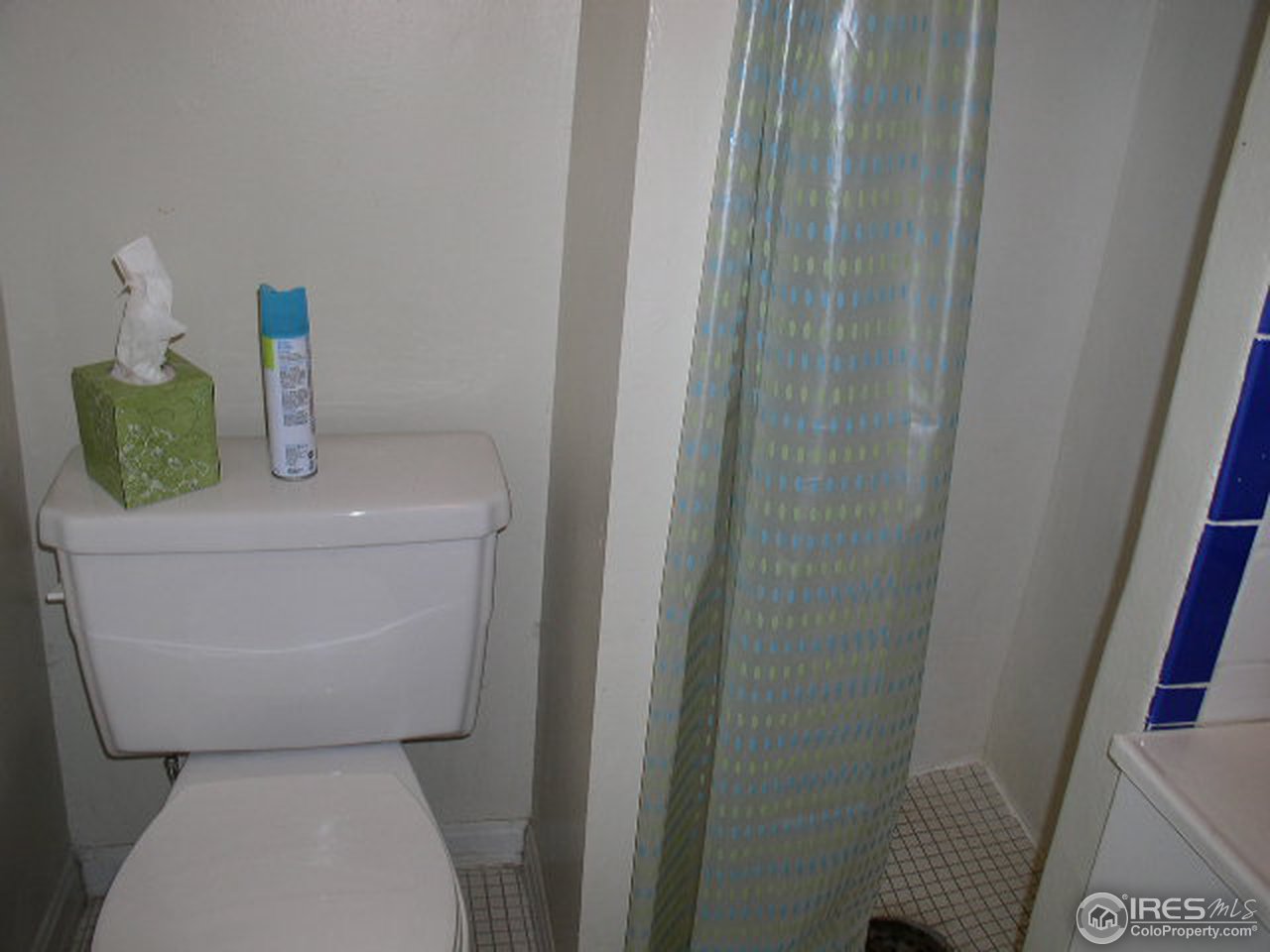 104 West Baseline Road Lafayette, CO 80026 - Photo 12 of 16 a bathroom with a toilet and sink