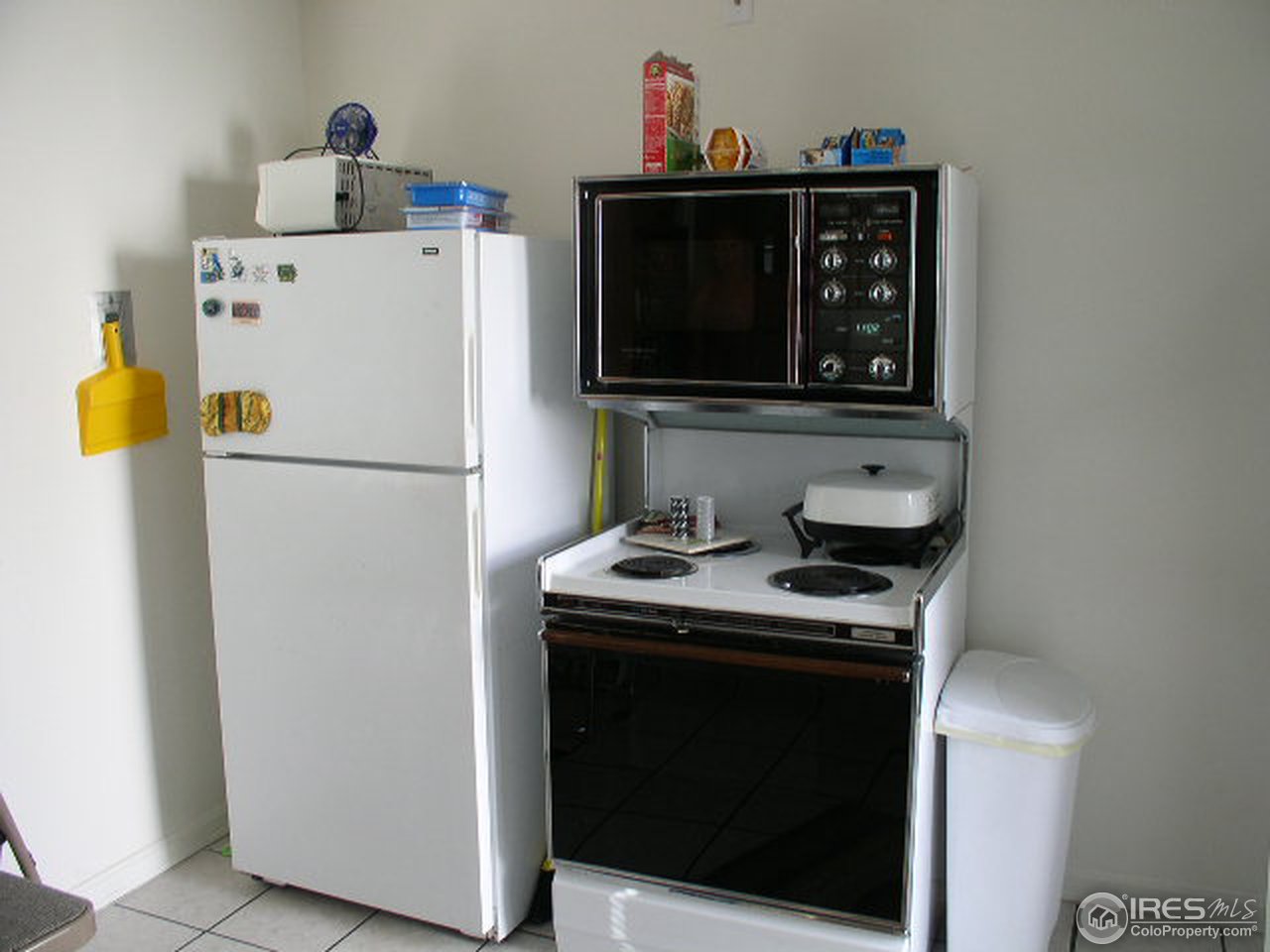104 West Baseline Road Lafayette, CO 80026 - Photo 7 of 16 a white stove top oven sitting inside of a kitchen