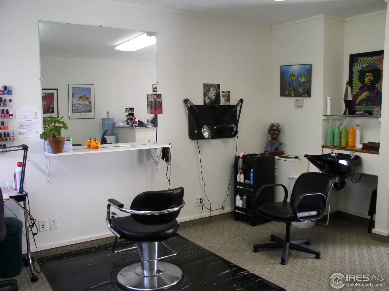 104 West Baseline Road Lafayette, CO 80026 - Photo 8 of 16 a work room with furniture and wooden floor