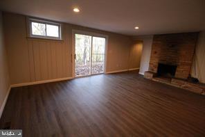 424 Trenton Road, Unit I Browns Mills, NJ 08015 - Photo 4 of 7 a view of an empty room with wooden floor and a window