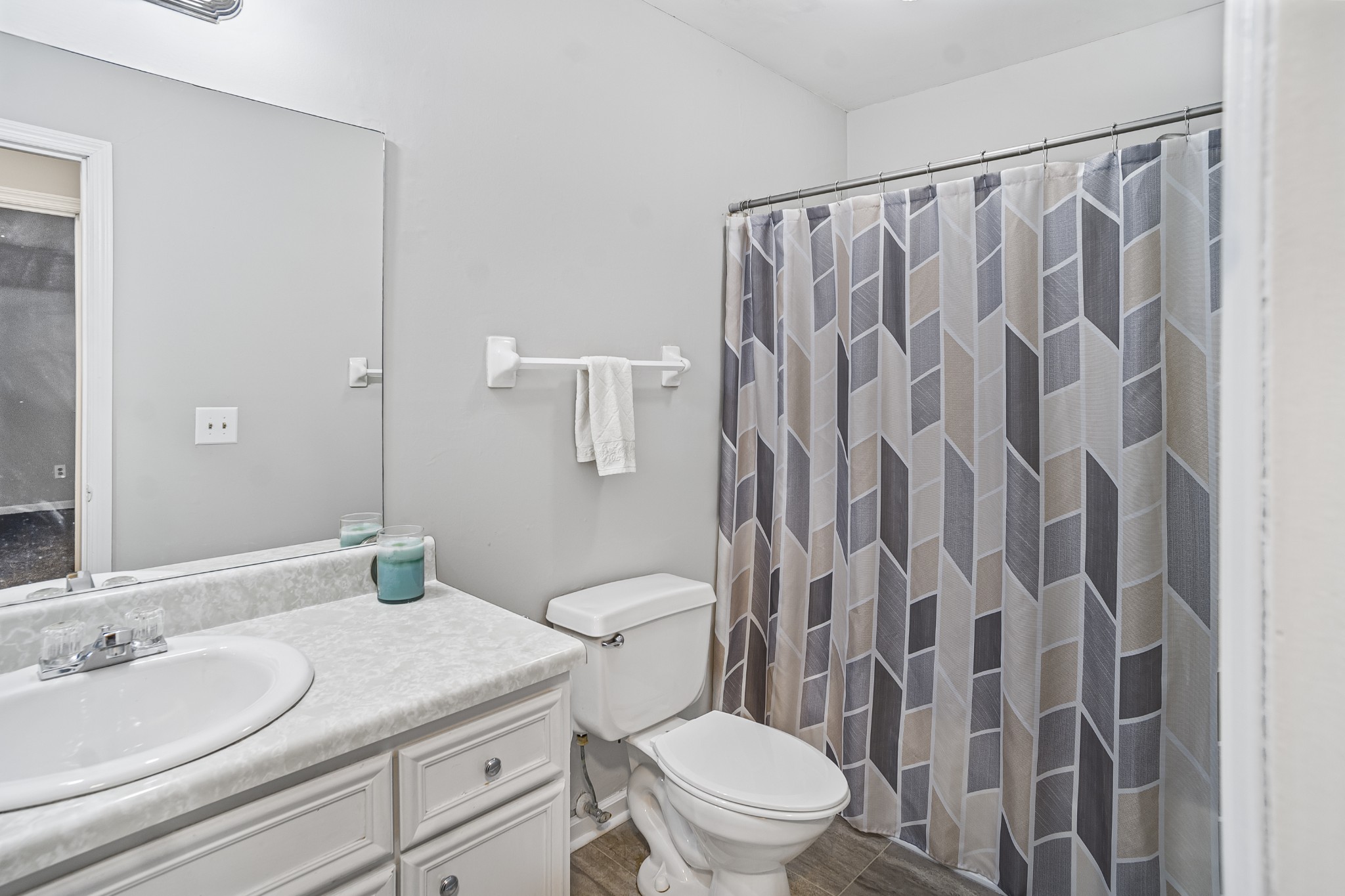 1301 Neelys Bend Road, Unit 9 Madison, TN 37115 - Photo 12 of 21 a bathroom with a granite countertop sink a toilet and a mirror