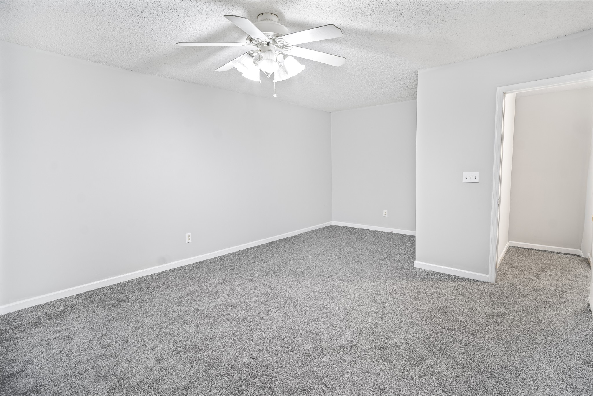 1301 Neelys Bend Road, Unit 9 Madison, TN 37115 - Photo 10 of 21 an empty room with a fan & a ceiling fan