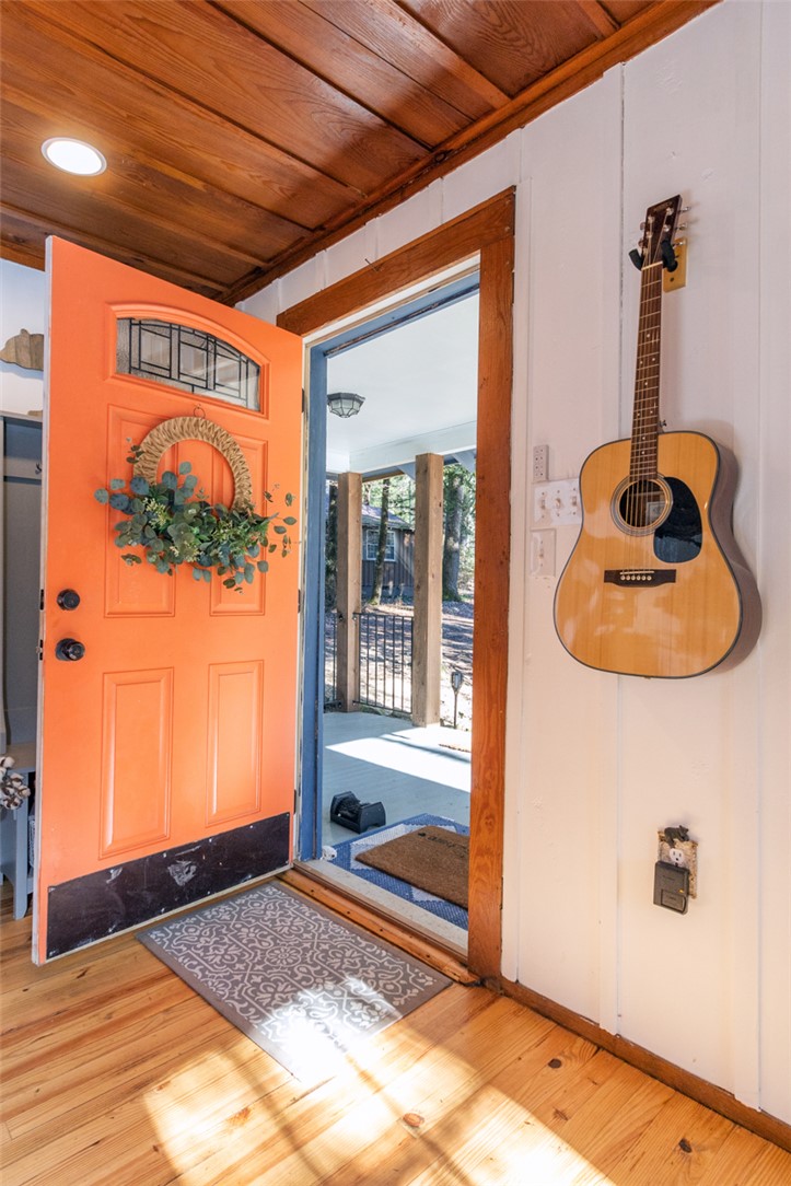 205 Rocky Bottom Road Sunset, SC 29685 - Photo 5 of 46 Warm wood floors and a wood-paneled ceiling frame this welcoming entryway.