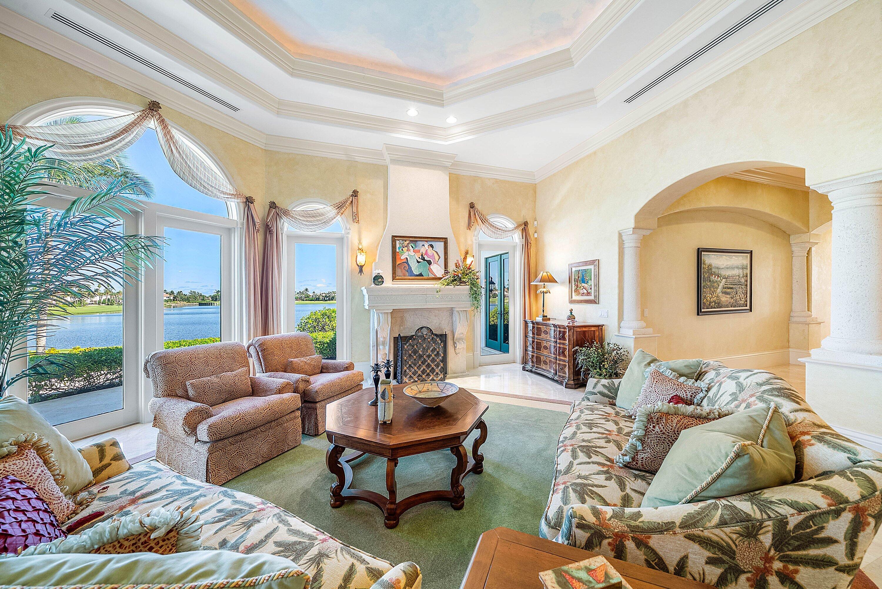 6381 Southeast Harbor Circle Stuart, FL 34996 - Photo 20 of 102 a living room with furniture fireplace and a large window