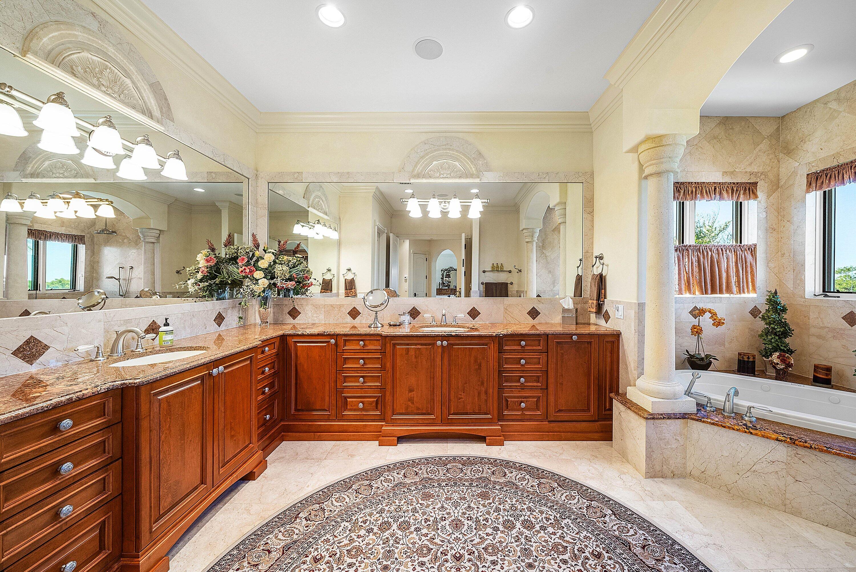 6381 Southeast Harbor Circle Stuart, FL 34996 - Photo 43 of 102 a large bathroom with a large tub and sink