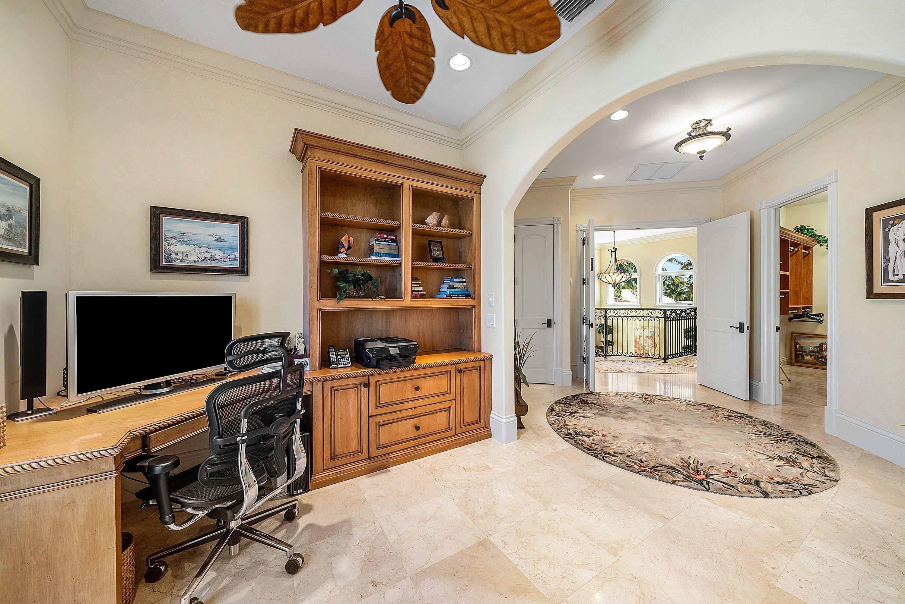 6381 Southeast Harbor Circle Stuart, FL 34996 - Photo 47 of 102 a view of a workspace with furniture and a flat screen tv