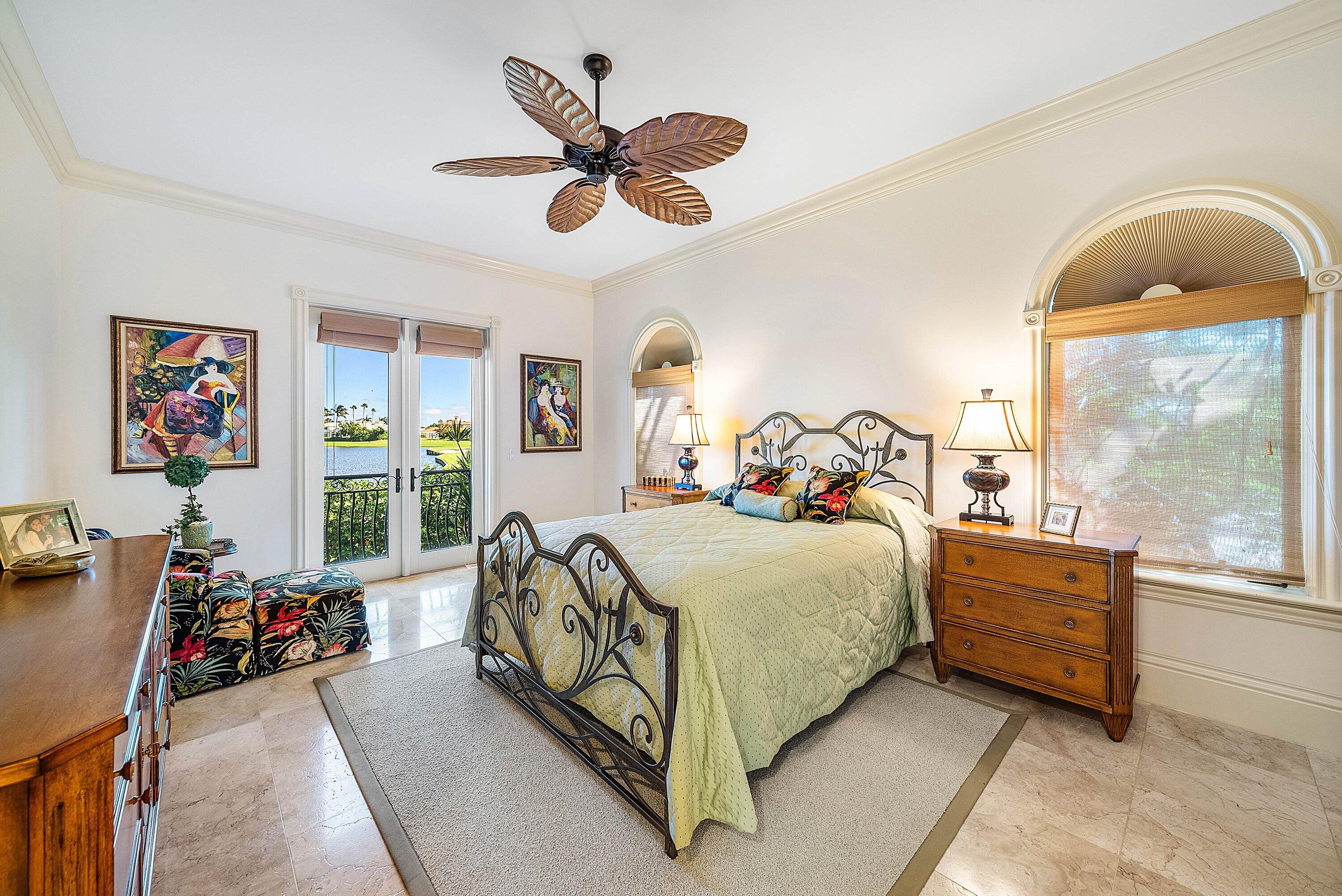 6381 Southeast Harbor Circle Stuart, FL 34996 - Photo 56 of 102 a bed room with a bed and a chandelier