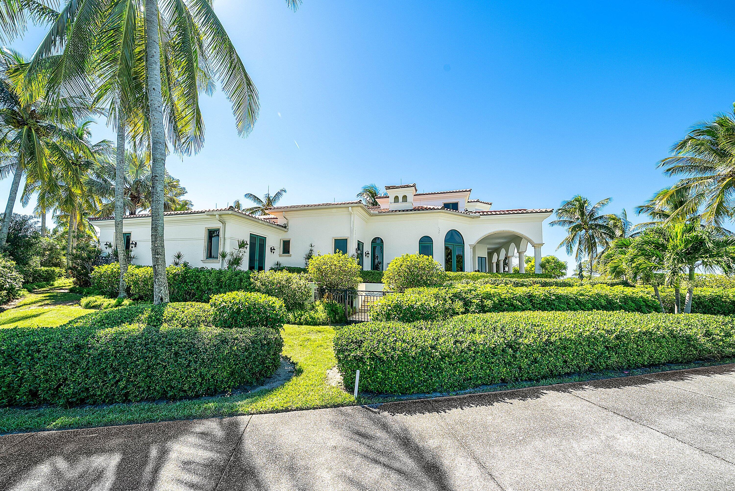 6381 Southeast Harbor Circle Stuart, FL 34996 - Photo 82 of 102 a front view of a house with a yard