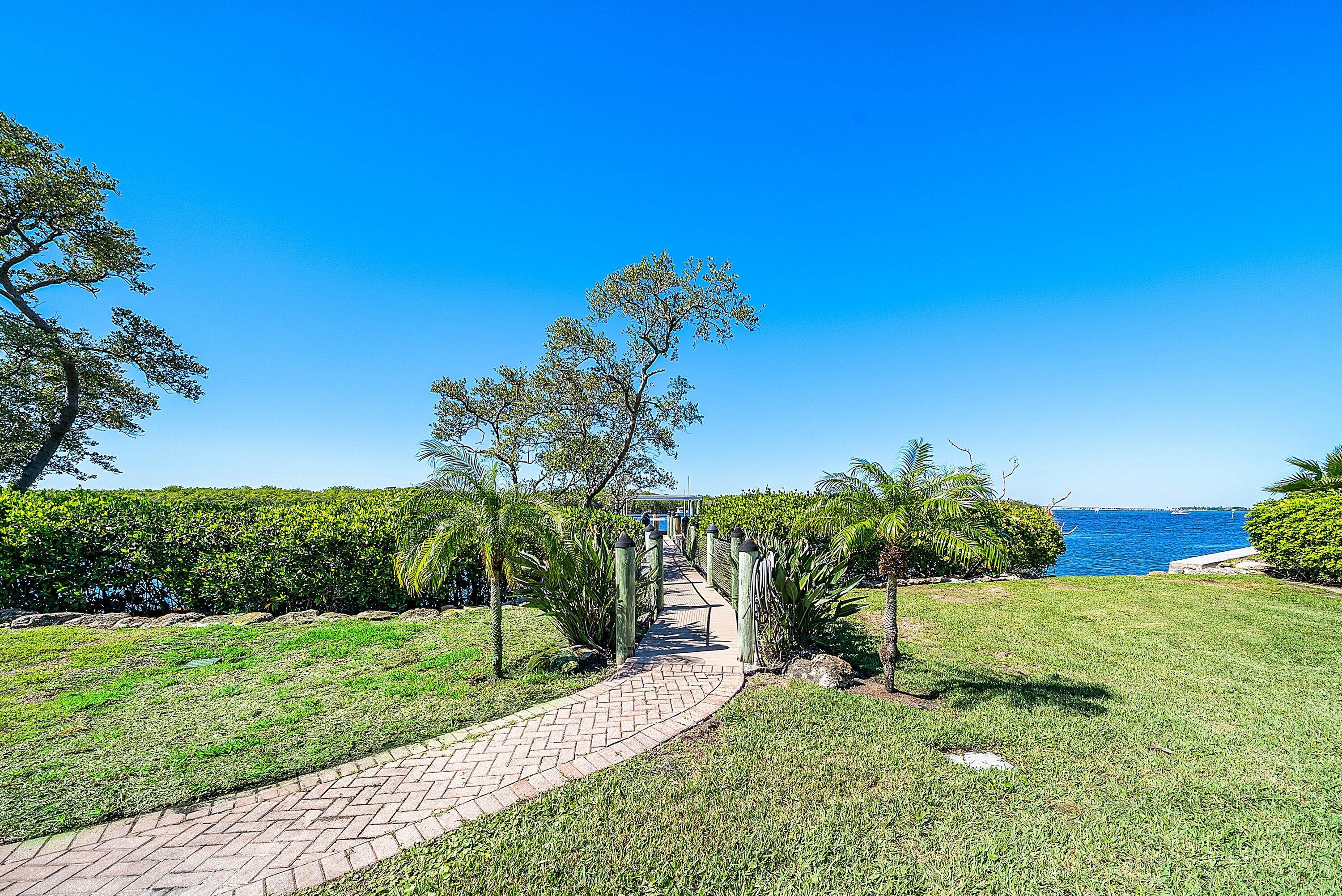 6381 Southeast Harbor Circle Stuart, FL 34996 - Photo 84 of 102 a view of a garden with a tree