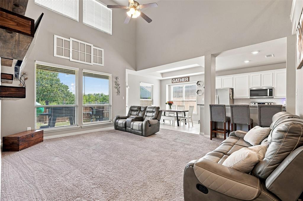 1321 Raleigh Path Denton, TX 76208 - Photo 10 of 35 Spacious living area featuring a vaulted ceiling and an open-concept design