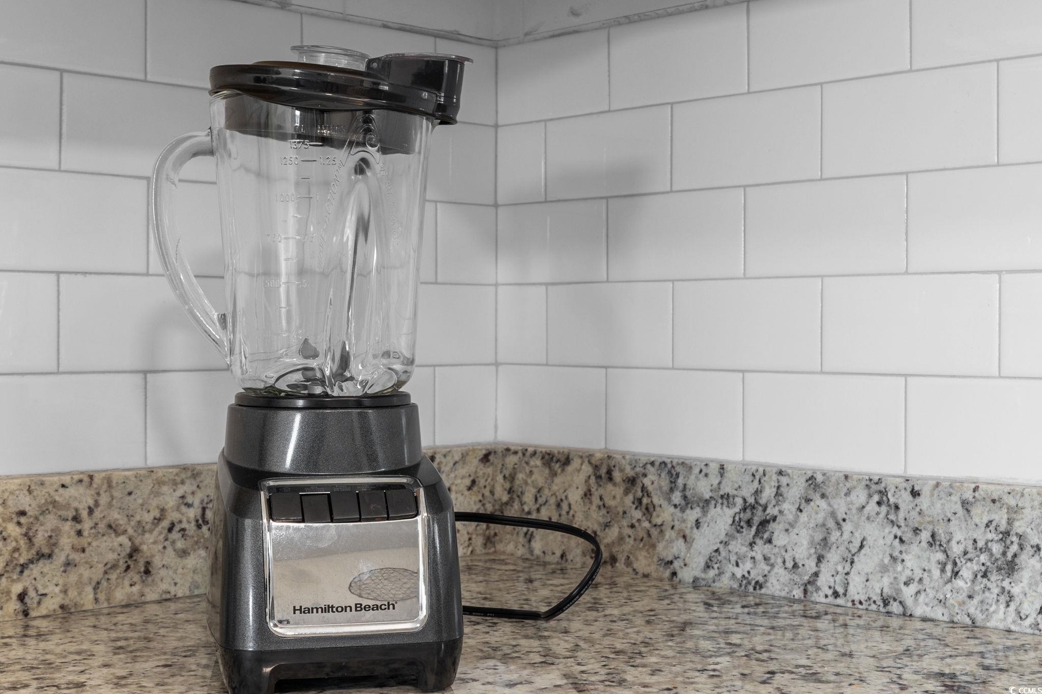409 17th Avenue North, Unit 1 Myrtle Beach, SC 29577 - Photo 13 of 26 Kitchen view of light stone countertops