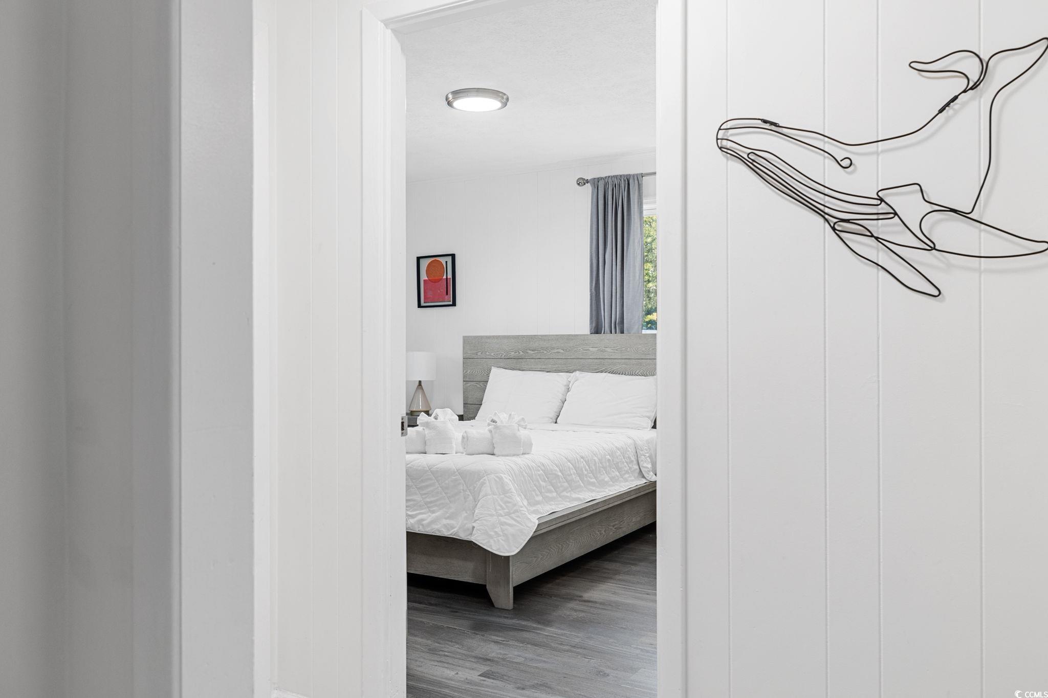 409 17th Avenue North, Unit 1 Myrtle Beach, SC 29577 - Photo 19 of 26 Bedroom with wood finished floors