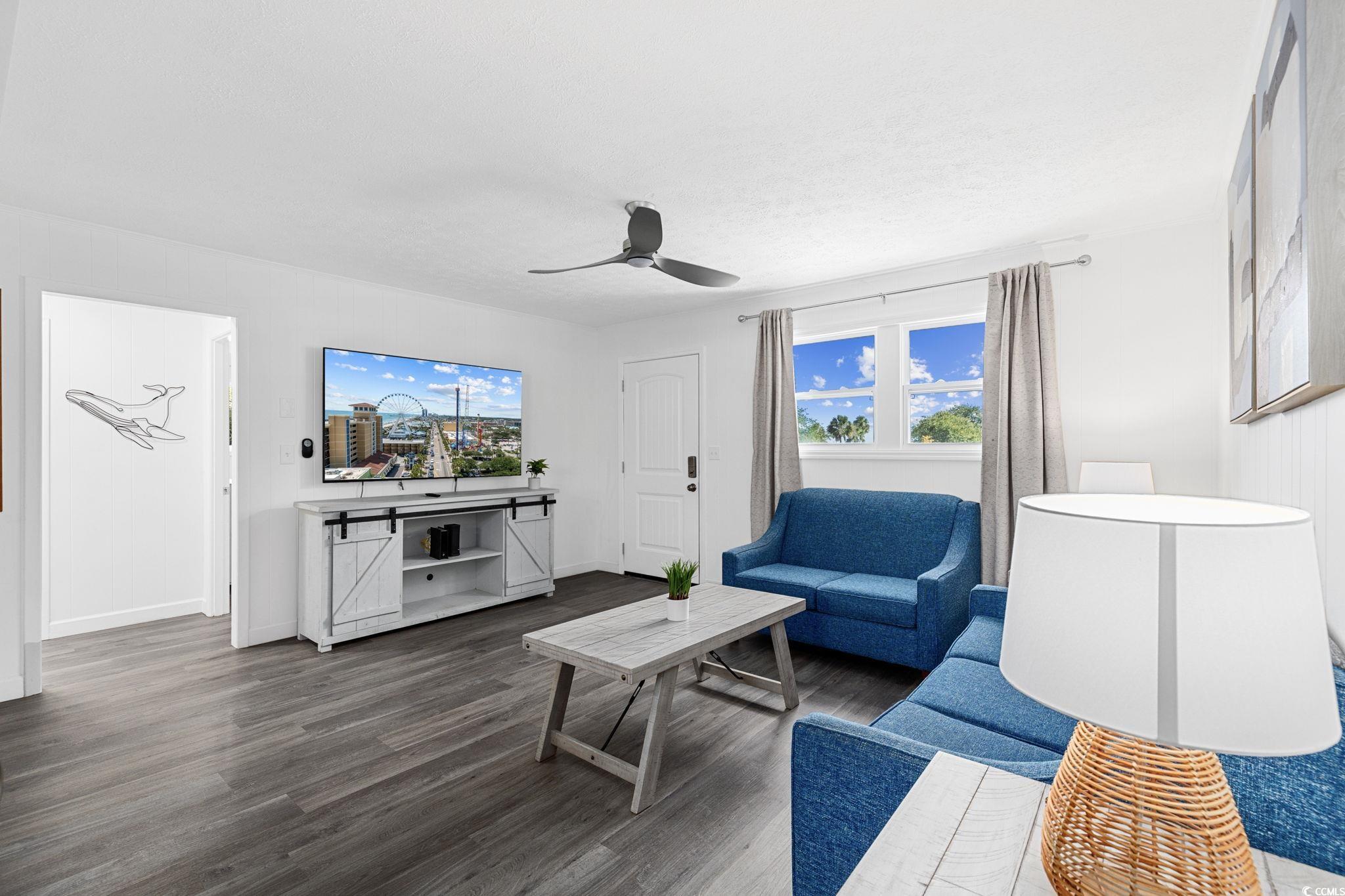 409 17th Avenue North, Unit 1 Myrtle Beach, SC 29577 - Photo 5 of 26 Living room with wood finished floors and ceiling fan