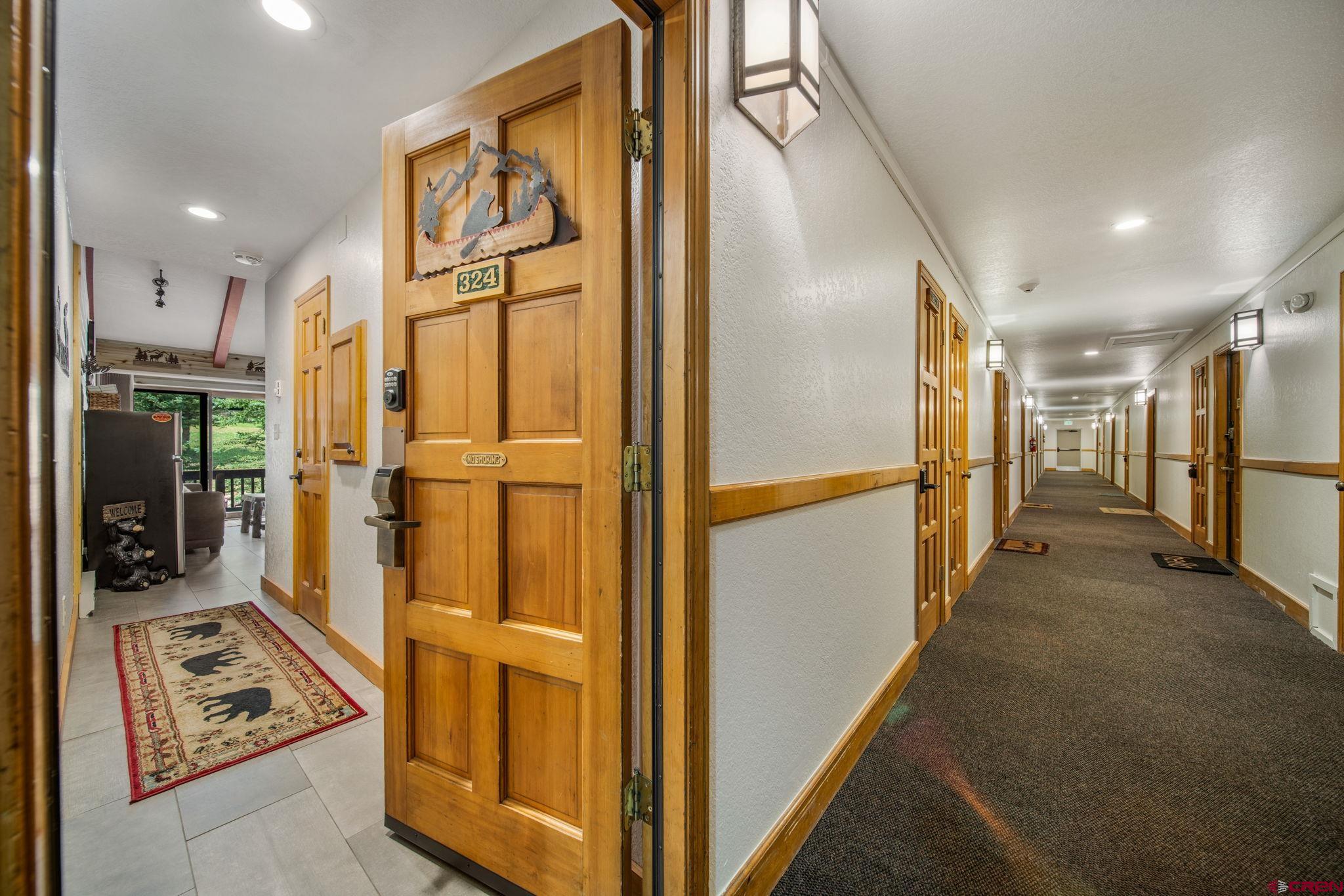 50827 Highway 550, Unit 324 Durango, CO 81301 - Photo 18 of 19 a view of a hallway with stainless steel appliances granite countertop cabinets and a window