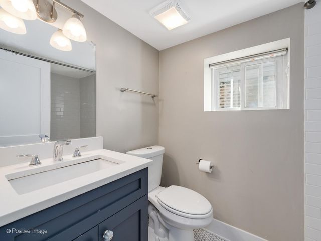 a balcony with furniture and a potted plant