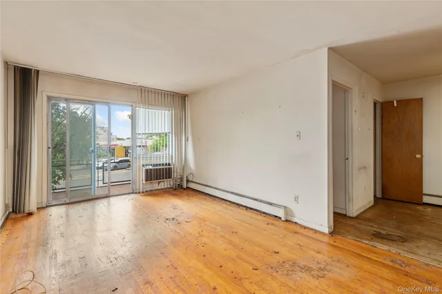 a view of empty room with a fireplace
