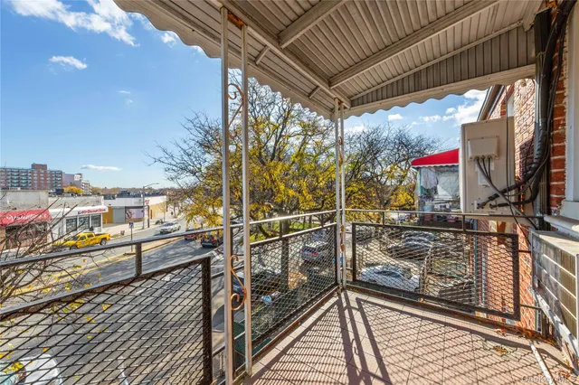 a view of a balcony with wooden floor