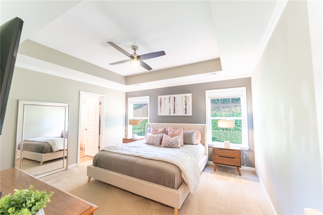 1012 Whirlaway Circle Anderson, SC 29621 - Photo 10 of 25 A tray ceiling and ceiling fan enhance the comfort and appeal of this peaceful primary bedroom.