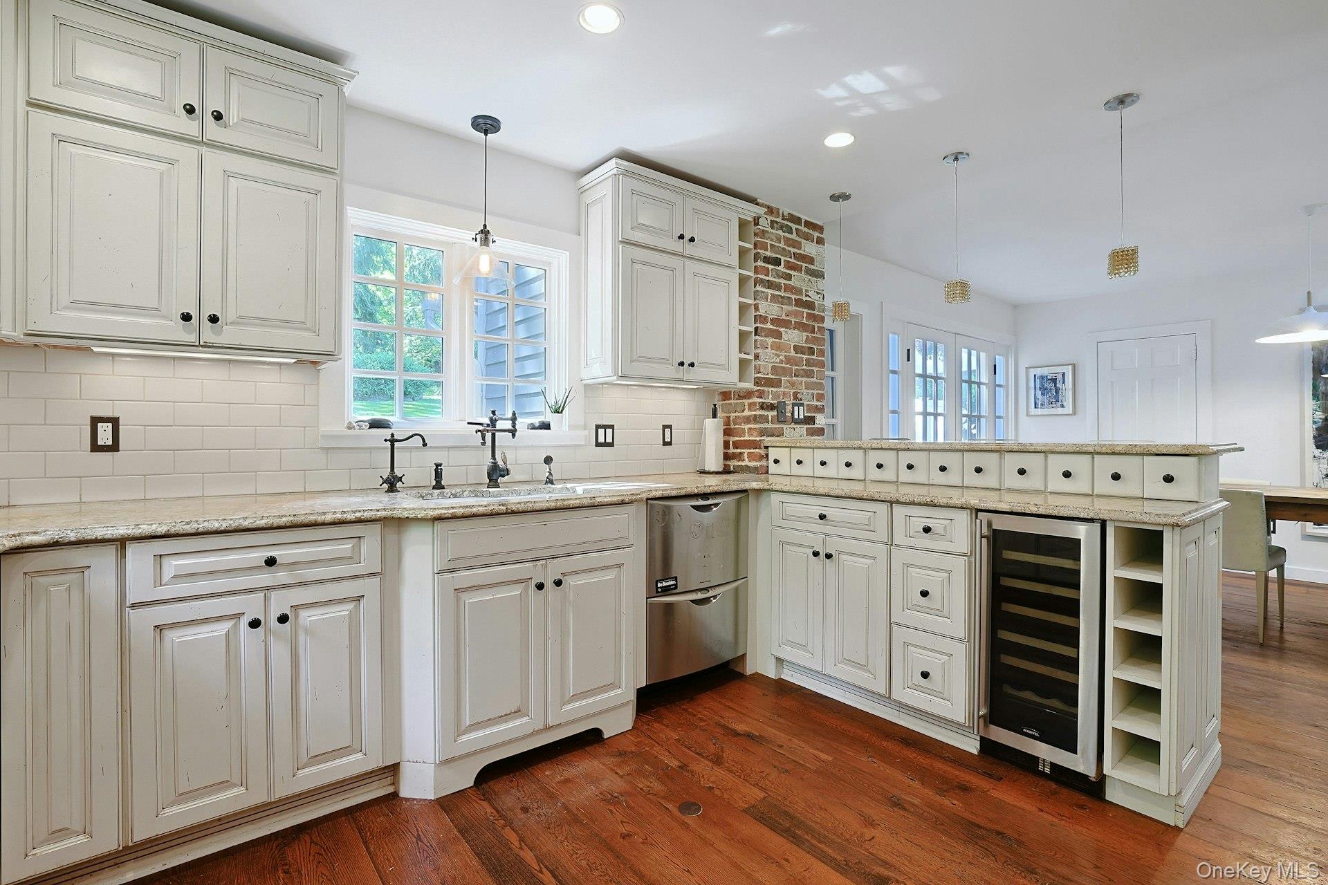 65 Douglas Road Chappaqua, NY 10514 - Photo 19 of 41 The kitchen is perfectly positioned near the dining area and patio, creating an easy flow for entertaining, and gathering with family and friends.