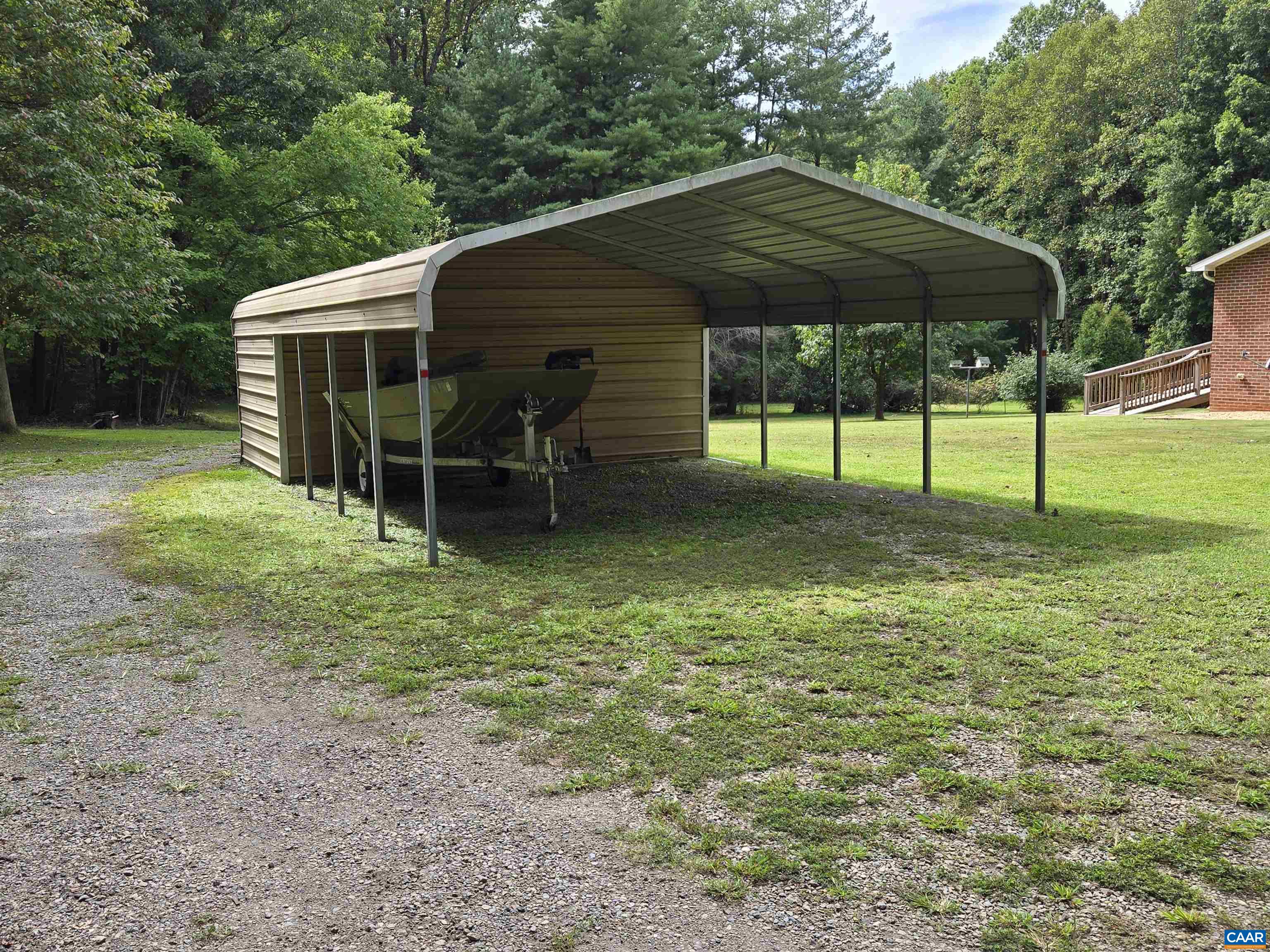5390 Buffalo Road Dillwyn, VA 23936 - Photo 19 of 22 a backyard of a house with table and chairs