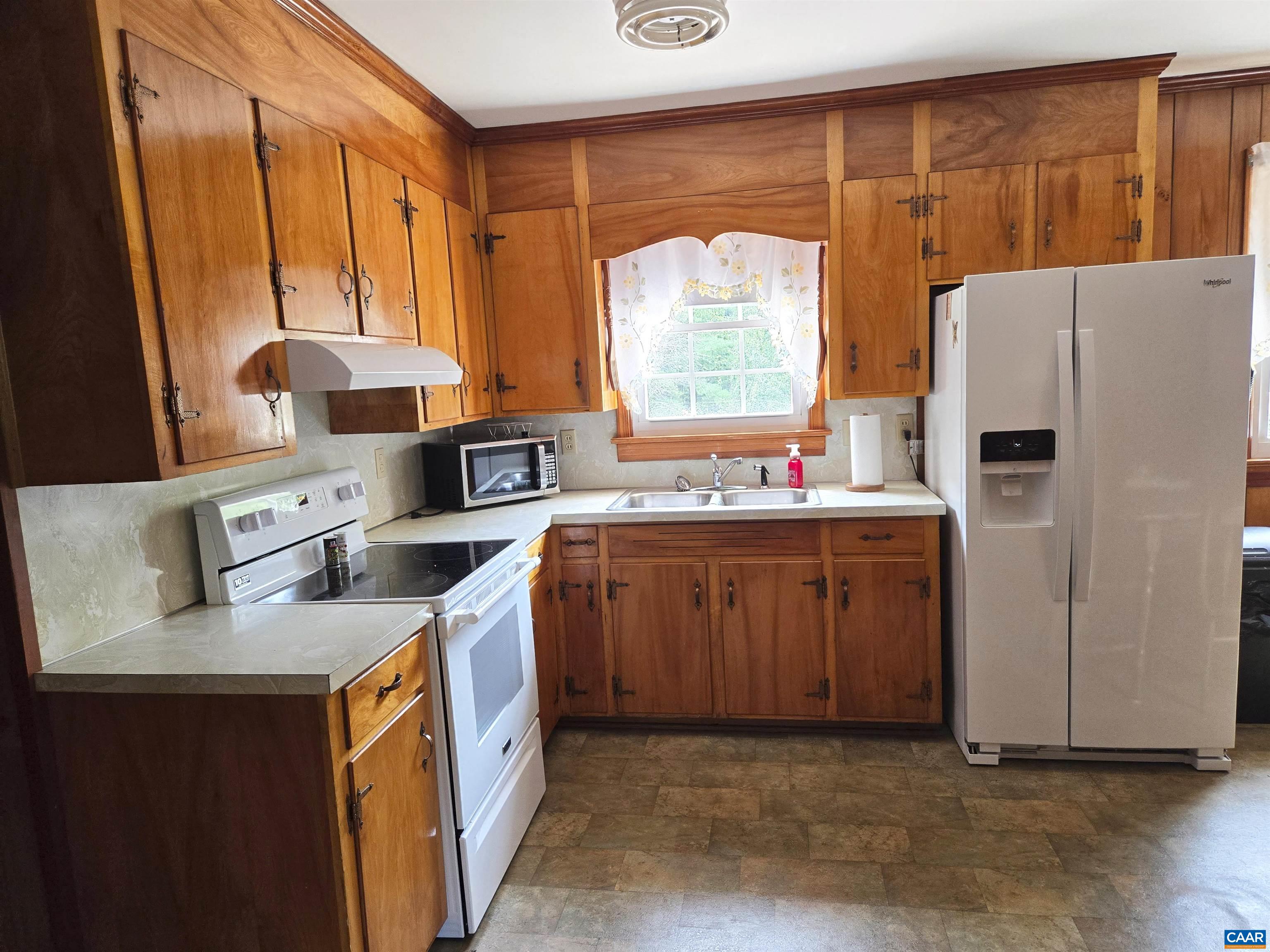 5390 Buffalo Road Dillwyn, VA 23936 - Photo 5 of 22 a kitchen with stainless steel appliances granite countertop a sink stove and refrigerator