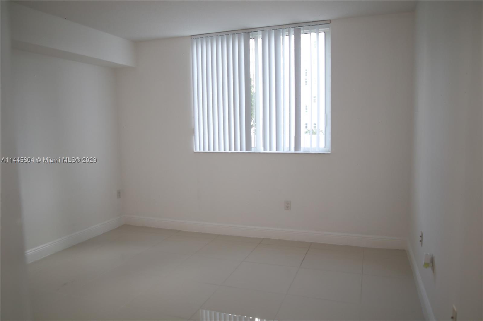 Grapeland Heights Miami, FL 33125 - Photo 11 of 36 an empty room with a window