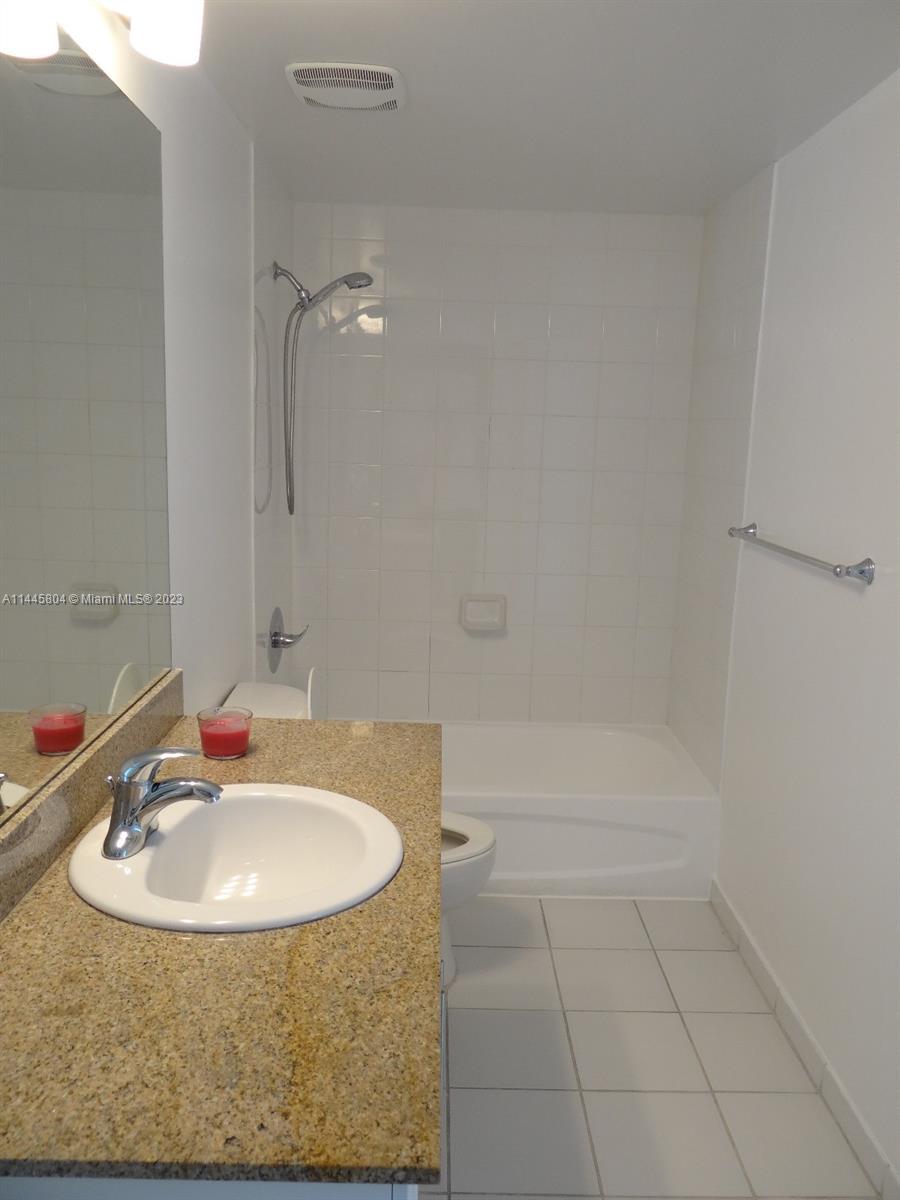 Grapeland Heights Miami, FL 33125 - Photo 15 of 36 a bathroom with a sink and a mirror