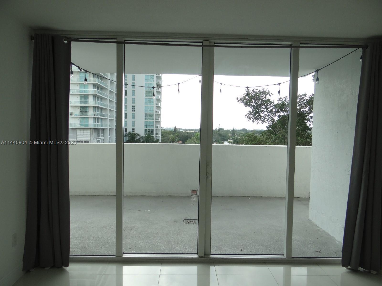 Grapeland Heights Miami, FL 33125 - Photo 18 of 36 a view of a glass door
