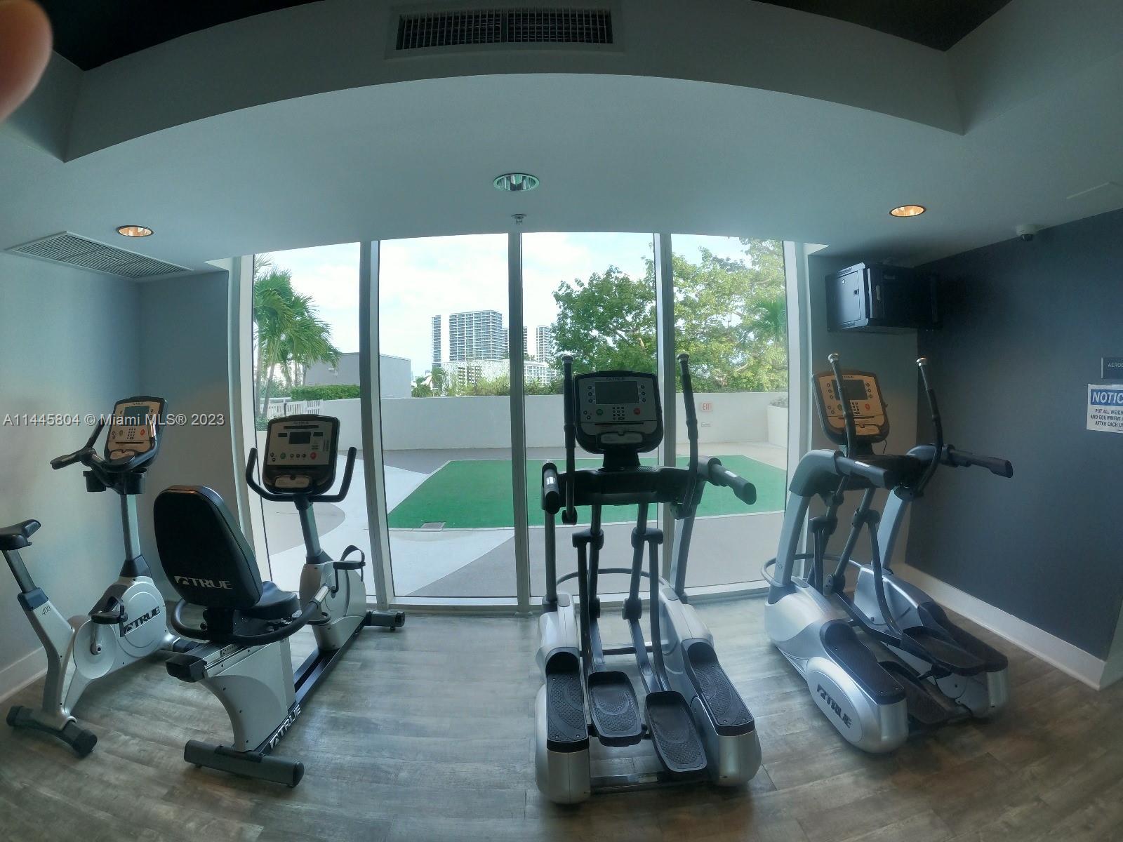 Grapeland Heights Miami, FL 33125 - Photo 22 of 36 a room with gym equipment and windows