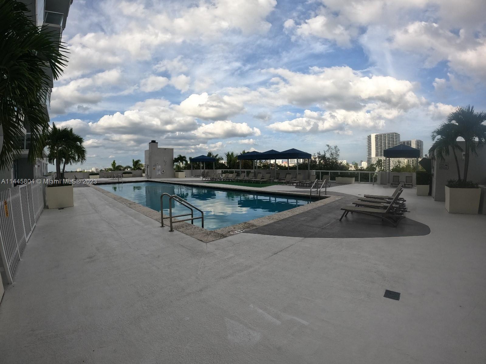 Grapeland Heights Miami, FL 33125 - Photo 26 of 36 a view of swimming pool with a yard