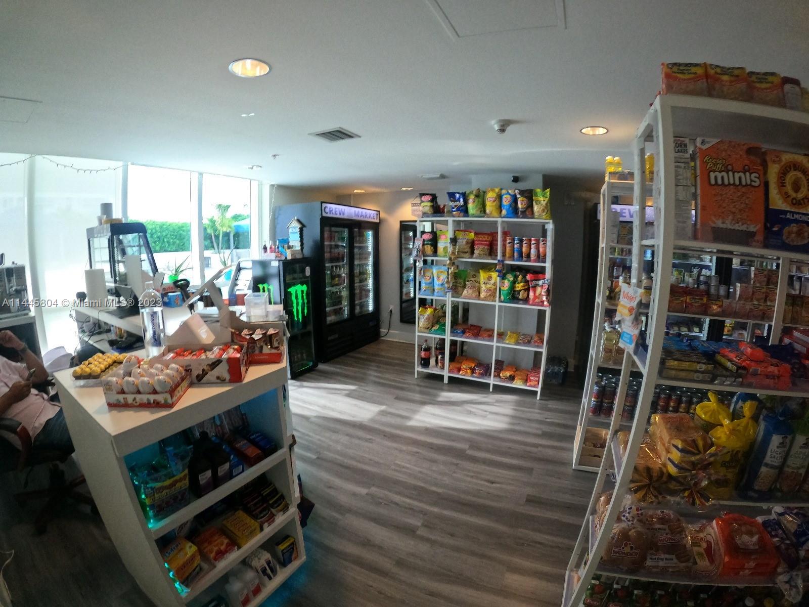 Grapeland Heights Miami, FL 33125 - Photo 32 of 36 a living room with lots of furniture and a wooden floor