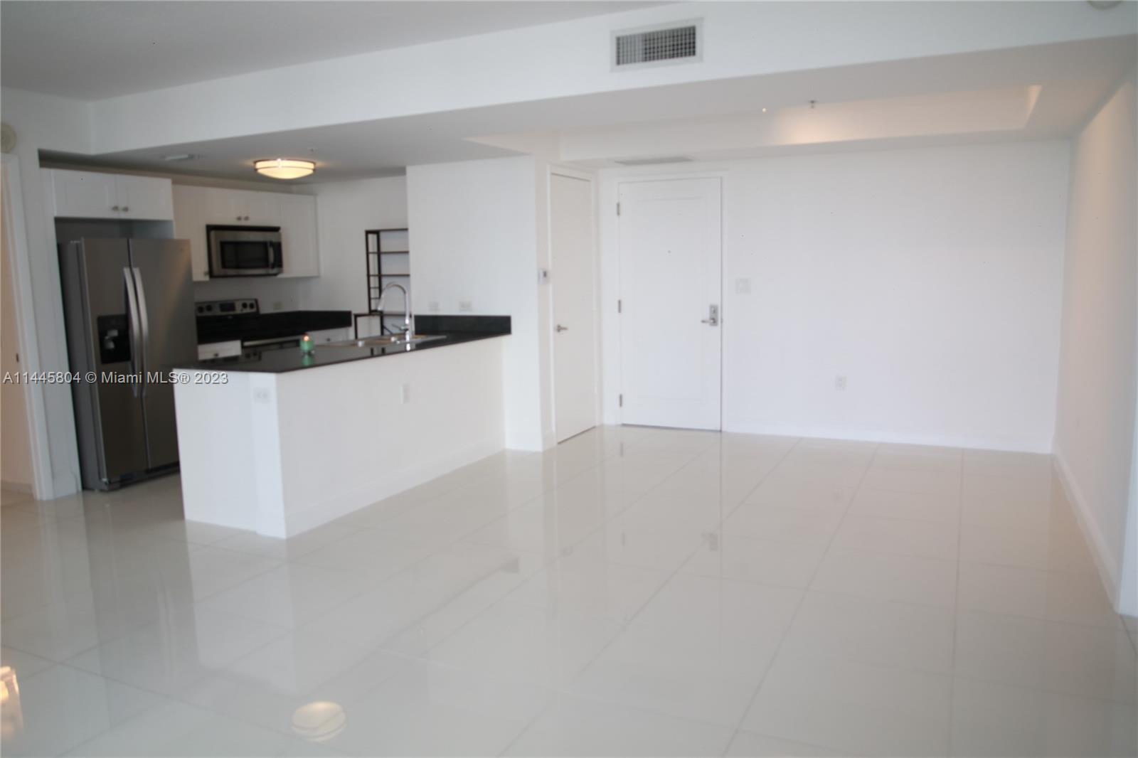 Grapeland Heights Miami, FL 33125 - Photo 6 of 36 a kitchen with stainless steel appliances a refrigerator and a stove top oven