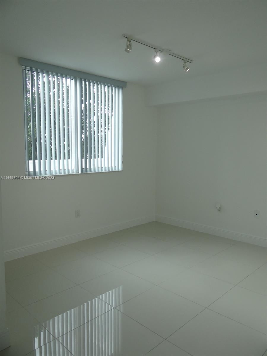 Grapeland Heights Miami, FL 33125 - Photo 10 of 36 an empty room with a window