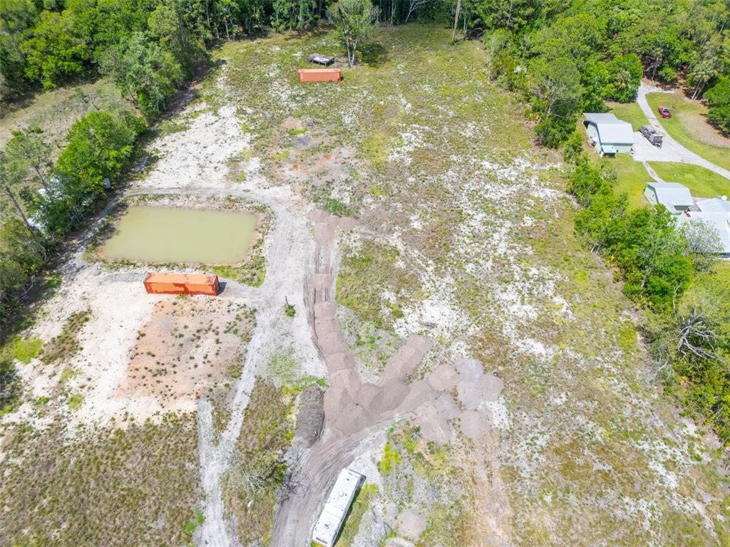 190 Pine Tree Lane Bunnell, FL 32110 - Photo 12 of 12 a view of a yard with plants and large trees