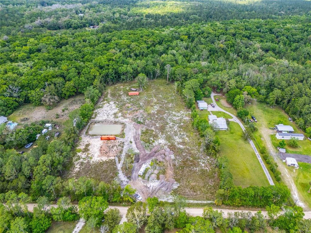 190 Pine Tree Lane Bunnell, FL 32110 - Photo 6 of 12 an aerial view of residential houses with outdoor space and trees all around