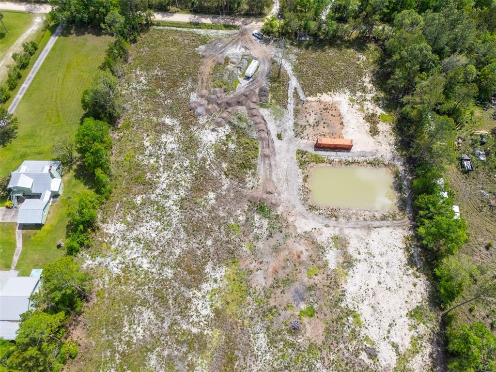 190 Pine Tree Lane Bunnell, FL 32110 - Photo 7 of 12 an aerial view of residential house with outdoor space and lake view