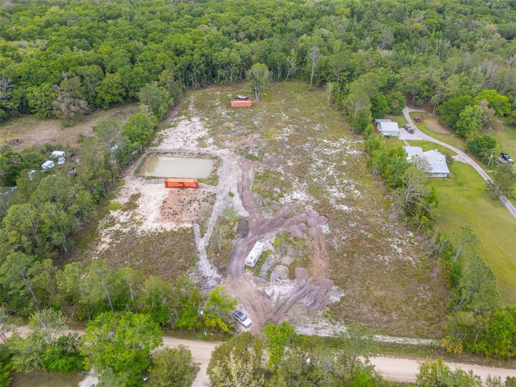 190 Pine Tree Lane Bunnell, FL 32110 - Photo 9 of 12 a view of a street with a yard