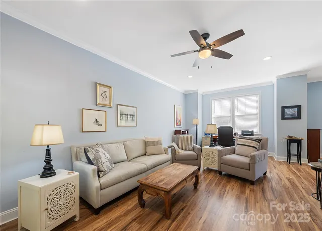 a living room with furniture and a lamp