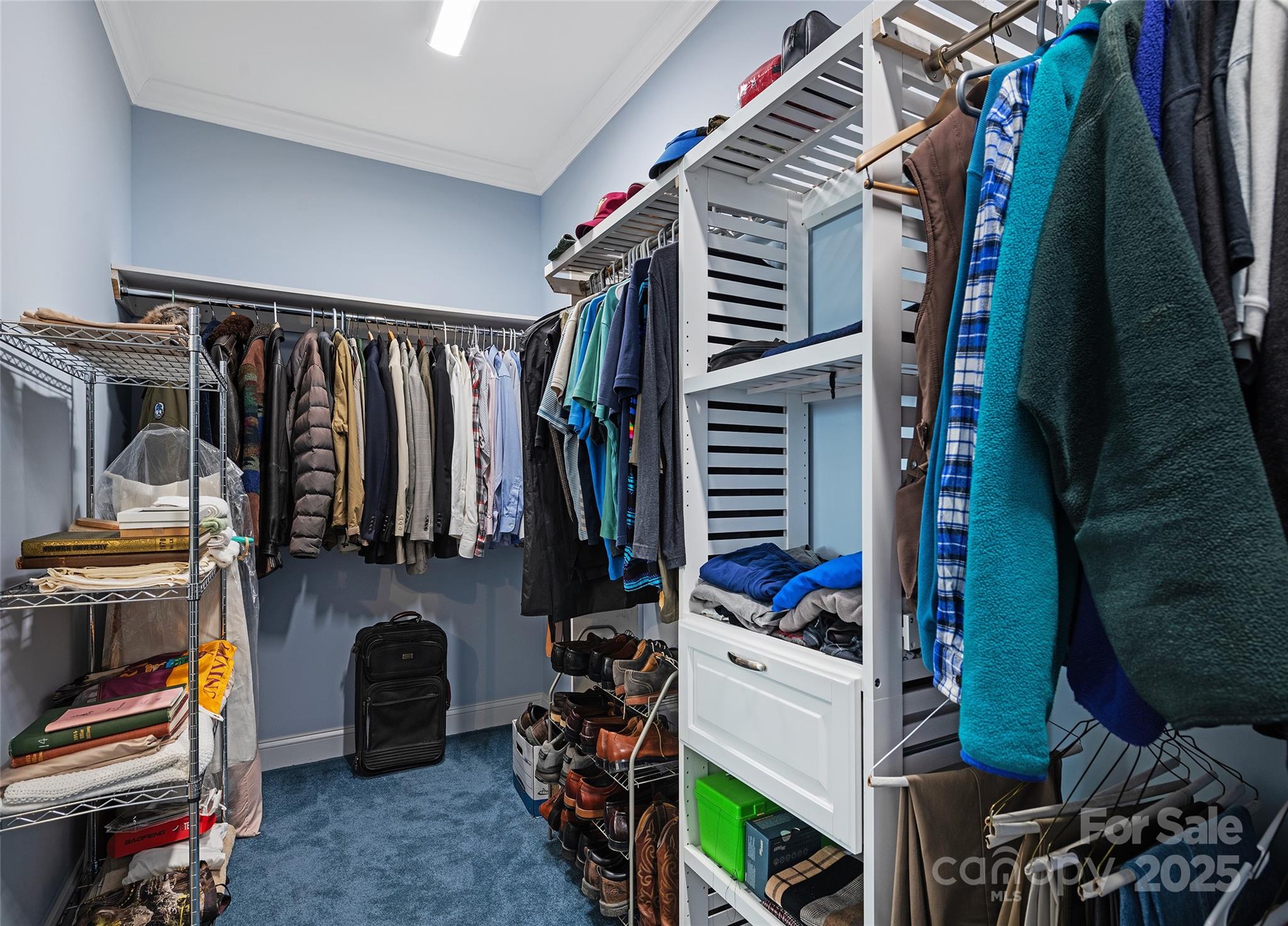 85 Garnet Spg Lane Waynesville, NC 28785 - Photo 22 of 36 a view of walk in closet with clothes and shoes