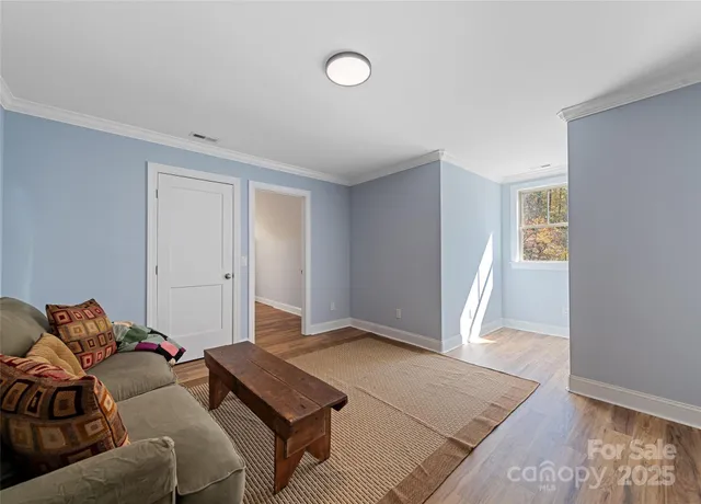 a living room with a couch and a rug