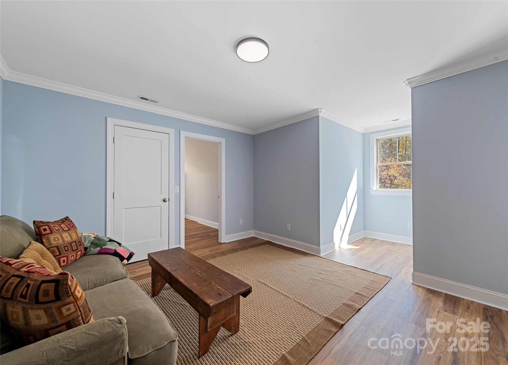85 Garnet Spg Lane Waynesville, NC 28785 - Photo 29 of 36 a living room with a couch and a rug