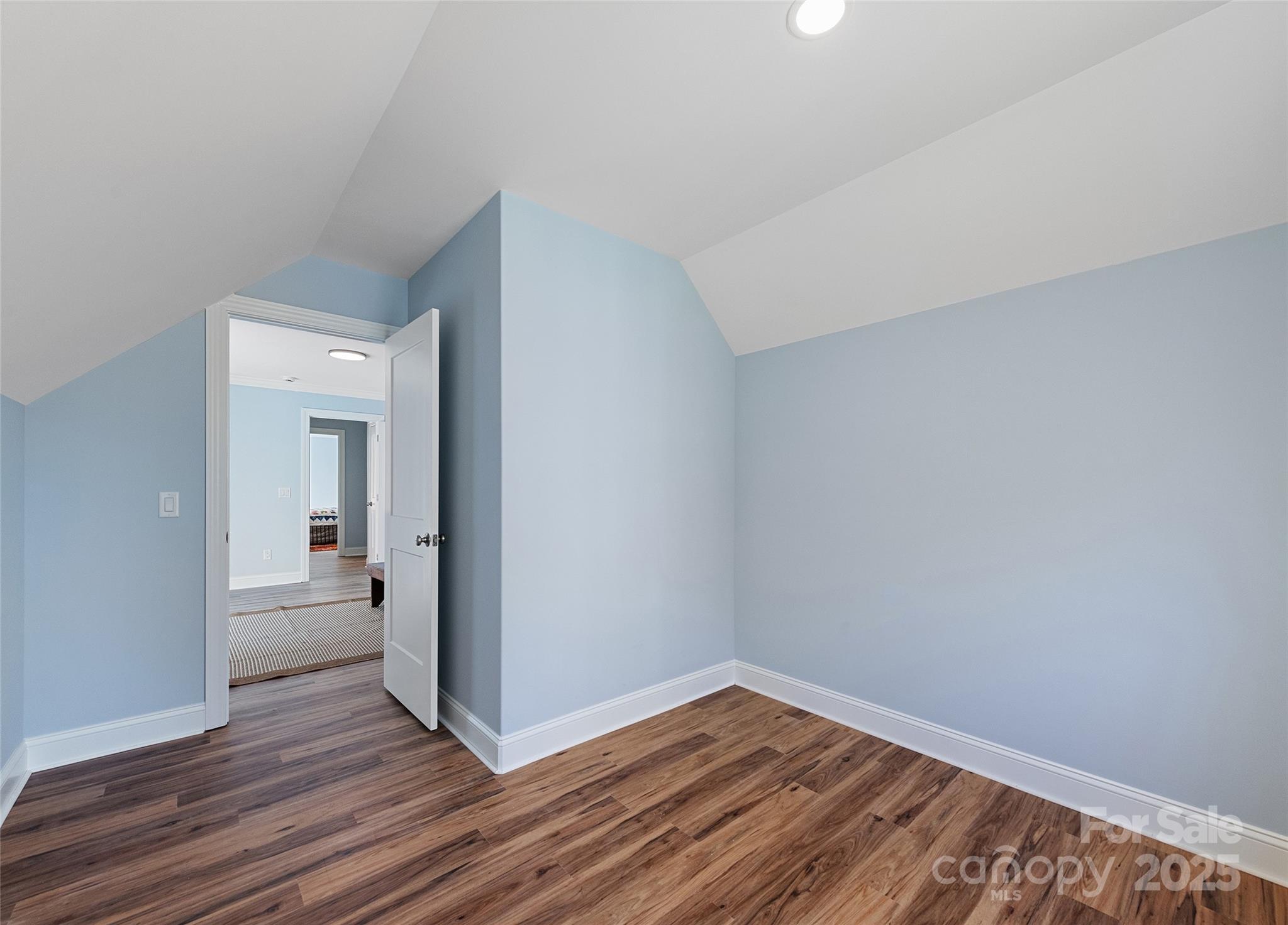 85 Garnet Spg Lane Waynesville, NC 28785 - Photo 32 of 36 a view of a room with wooden floor and a bathroom