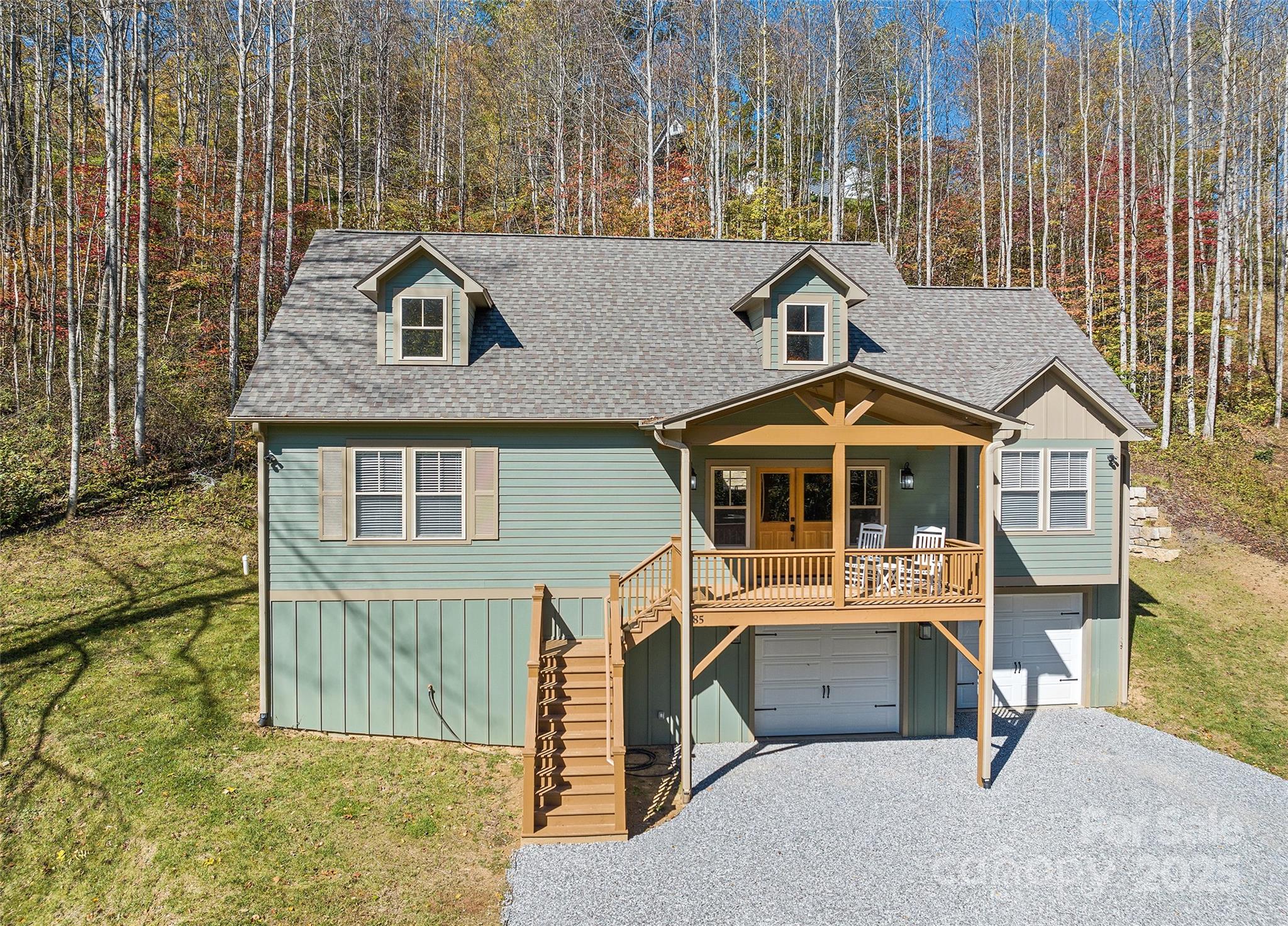 85 Garnet Spg Lane Waynesville, NC 28785 - Photo 36 of 36 a front view of a house with a yard