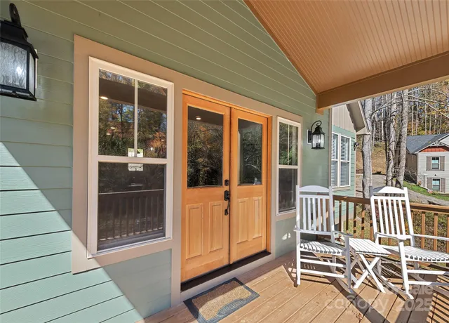 a view of a porch with a table and chair